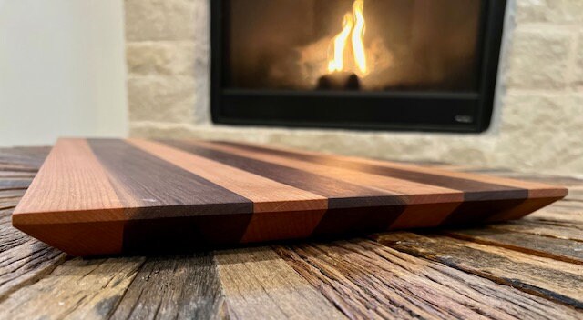 Walnut and Cherry Wood 26 3/4” wide 12 3/4” tall 1” thick Very beautifully done classic cutting board. XL size for Briskets and Ribs