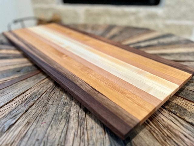 Handmade 29” wide 11 13/16” tall. This is an edge grain board and is 1 5/16” thick. This beast weighs in at just over 9lbs. Walnut, Beech